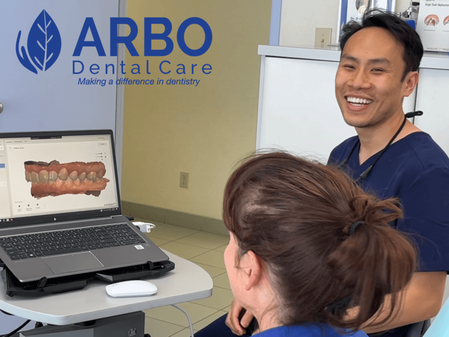 Dr. David Pham smiles while discussing digital dentistry with patient at Arbo Dental Care Bradford Ontario